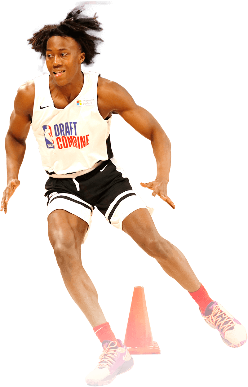 young athletic male running cone drills