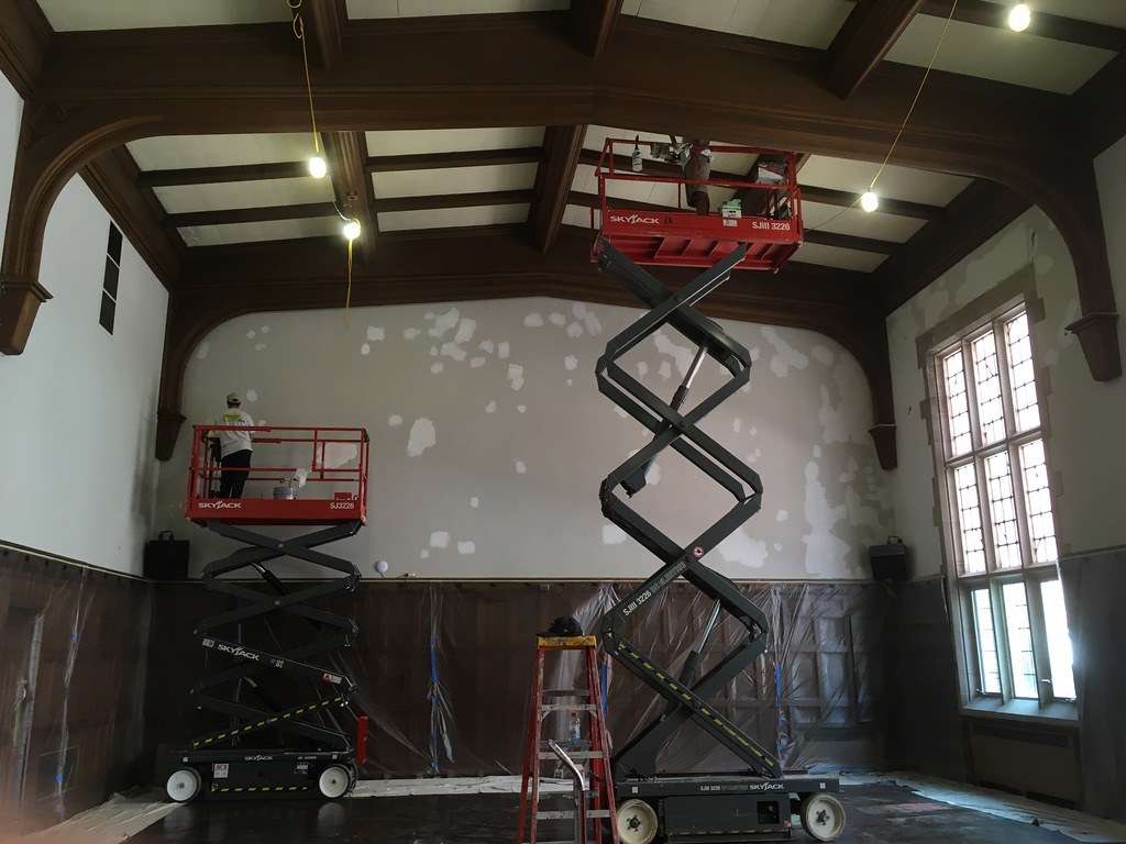 Latzer Hall during its restoration in the summer of 2020, with the trusses and paneling being refinished. University YMCA.
