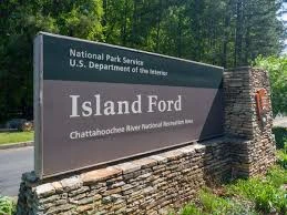 Stone entrance sign for Island Ford at Chattahoochee River National Recreation Area under National Park Service.