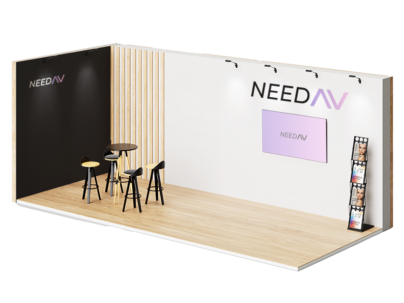 Modern exhibition booth with NEEDAV logo on white and black walls, featuring a mounted screen displaying NEEDAV, black stools around a tall table, and a brochure stand with colorful brochures.