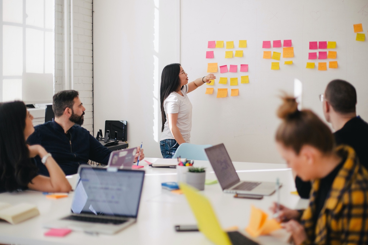 a team meeting where people gather and discuss 