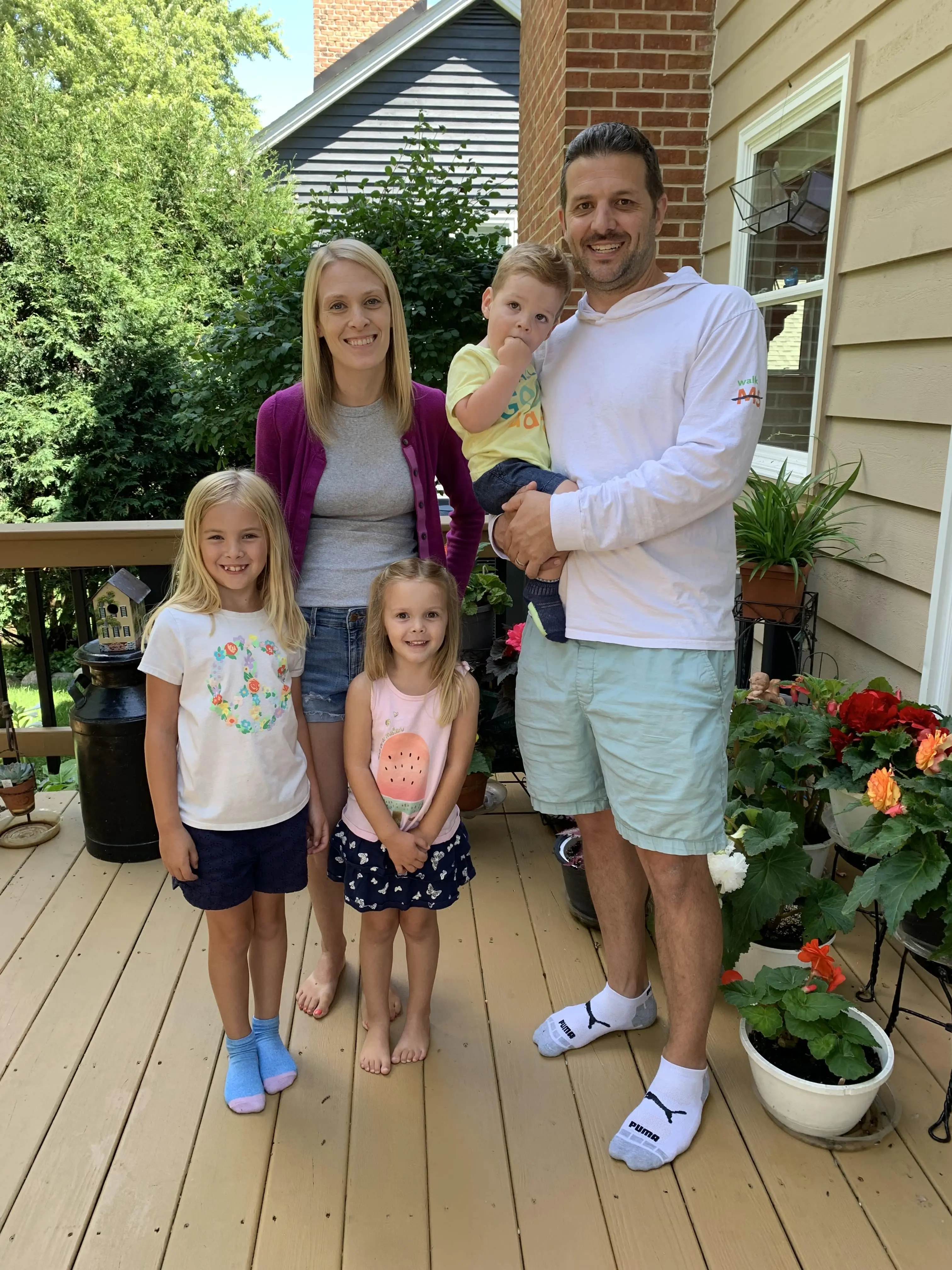 Sean, his partner, and his three children posing for a picture