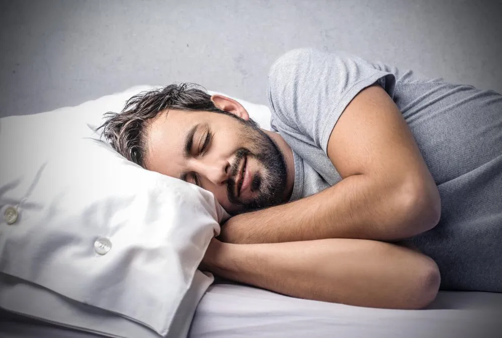 man sleeping soundly after getting nightguard