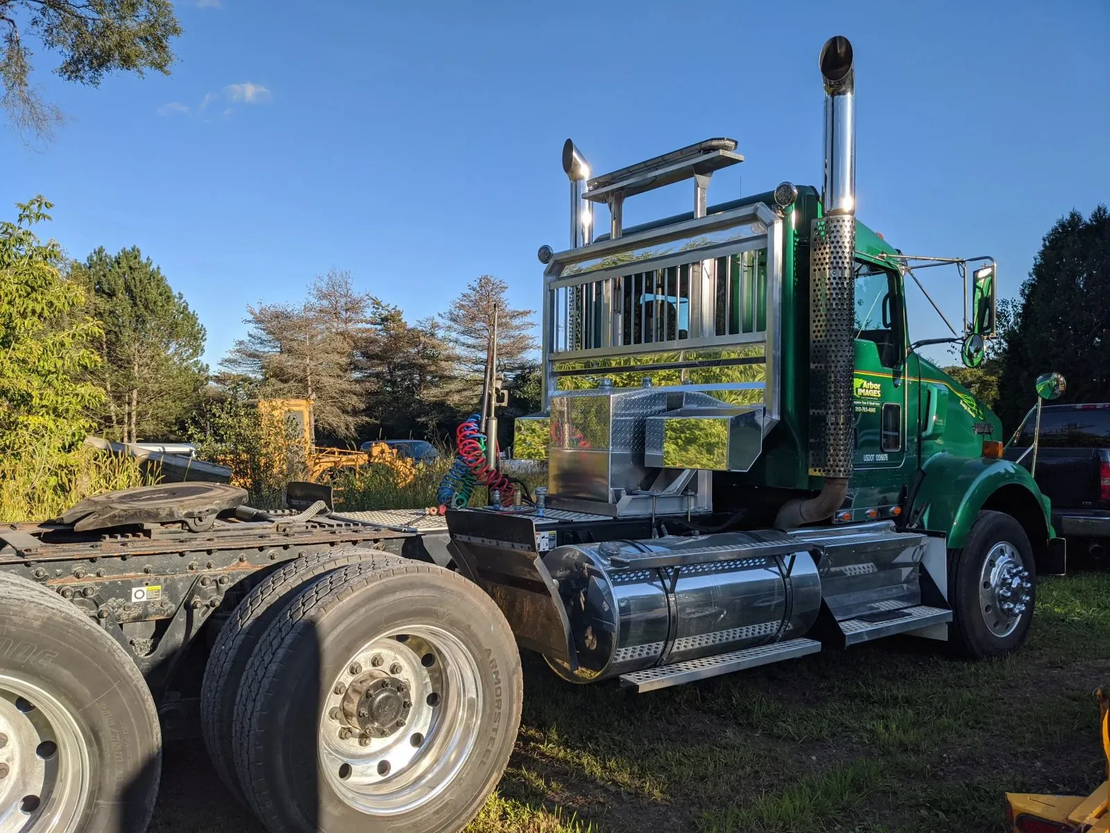 Green truck in for repairs at HHH