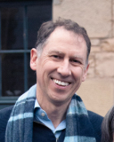 A photo of Ross Laird smiling.