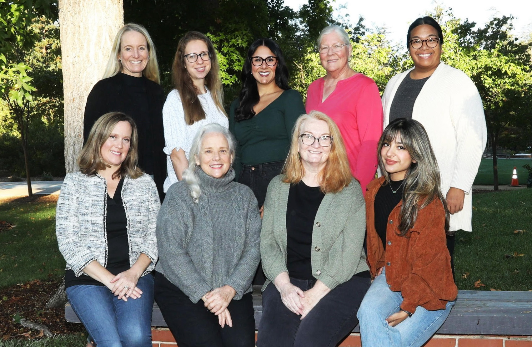 Group photo of Playschool Atherton teachers in Playschool t-shirts and sweatshirts