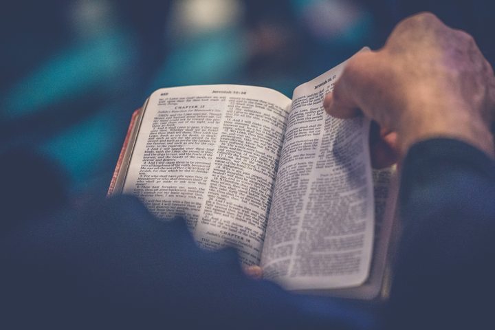 Friends gathered around open Bibles