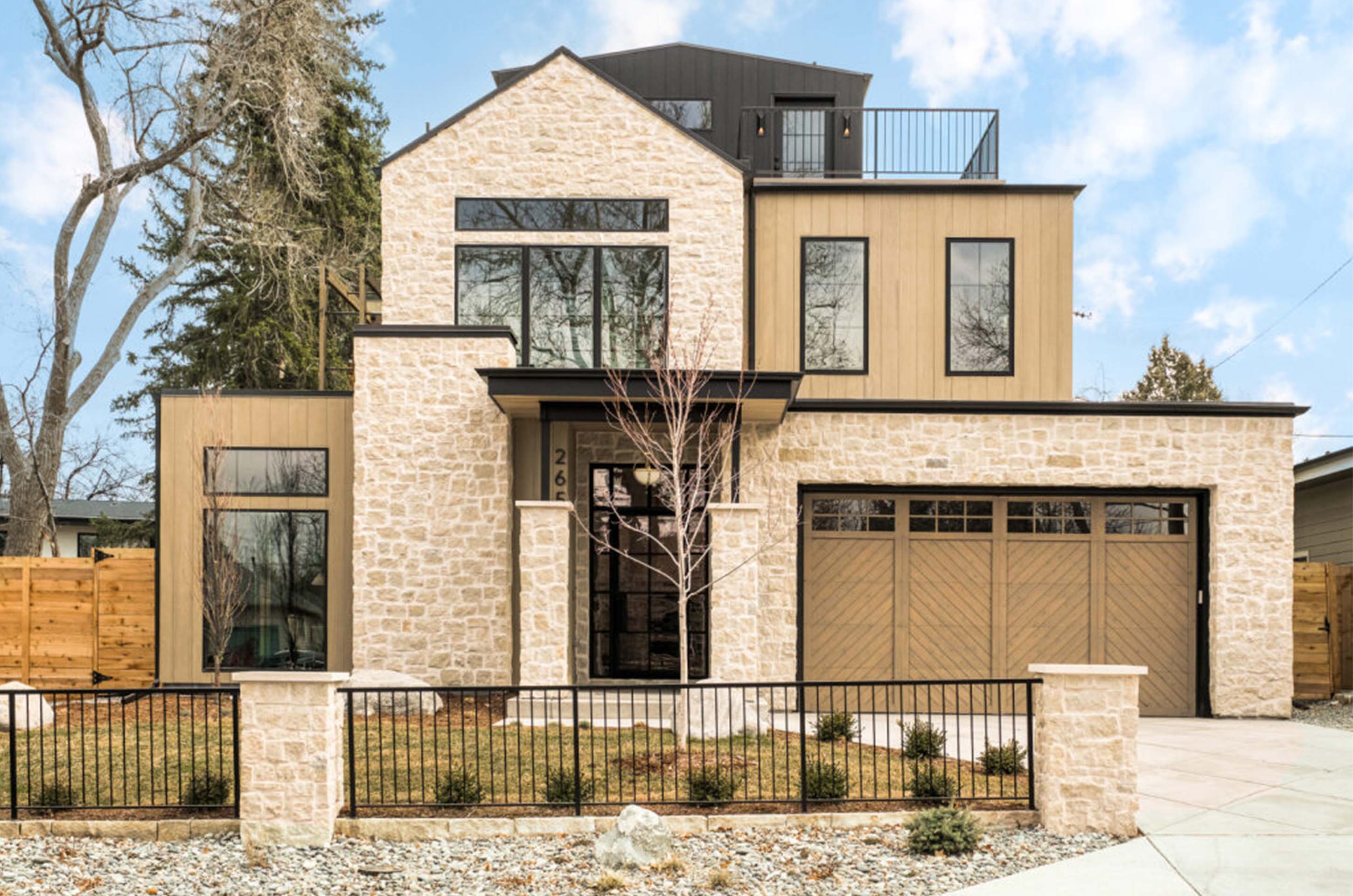 Exterior view of Observatory Park Modern Classic home with timeless brick and modern black accents.