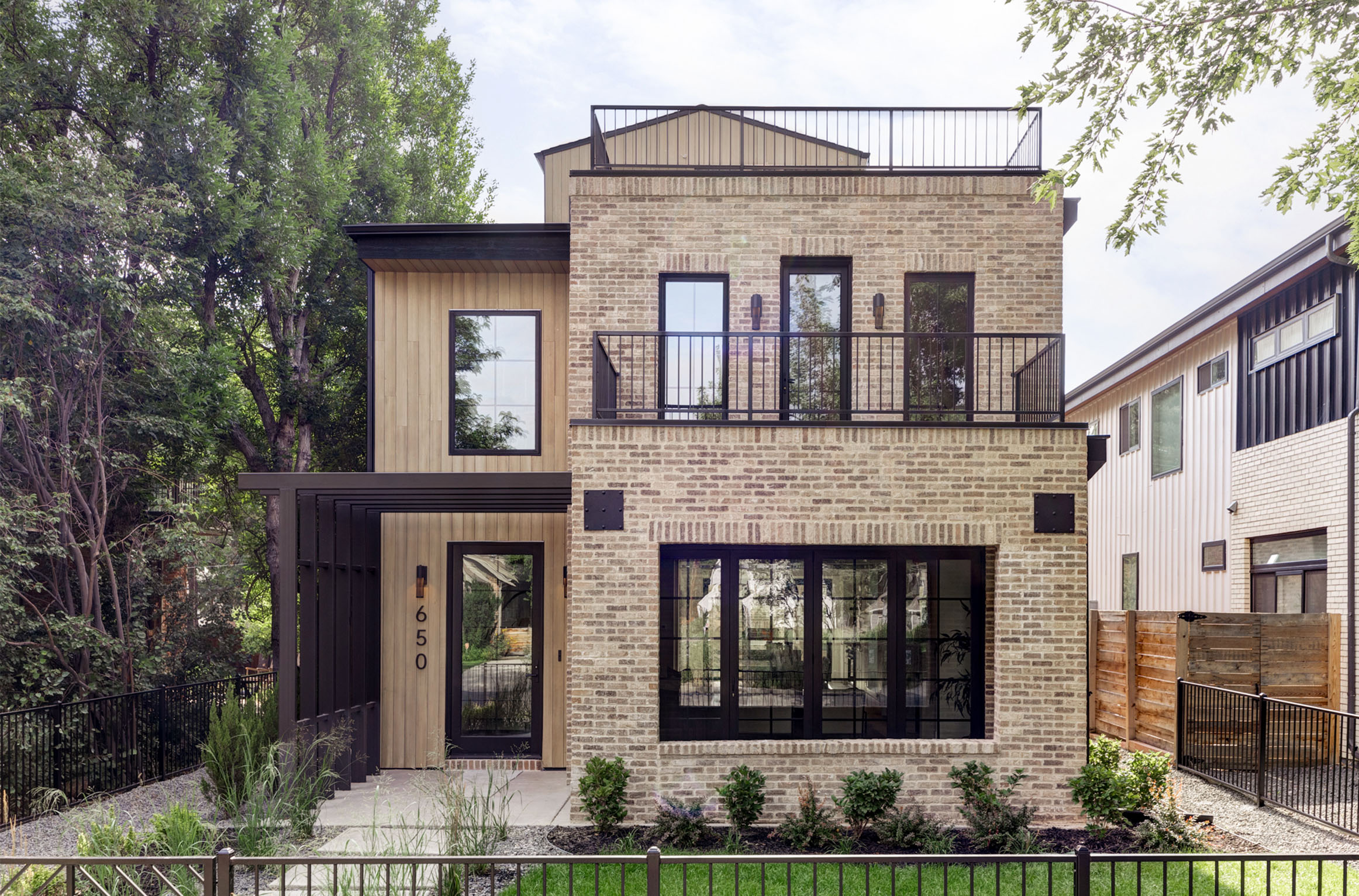 Front exterior of Wash Park Modern Luxe home with clean modern lines and large windows.