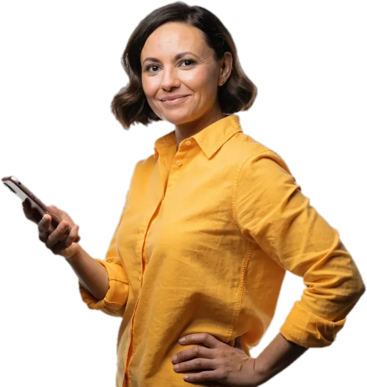 A smiling working parent holding her phone