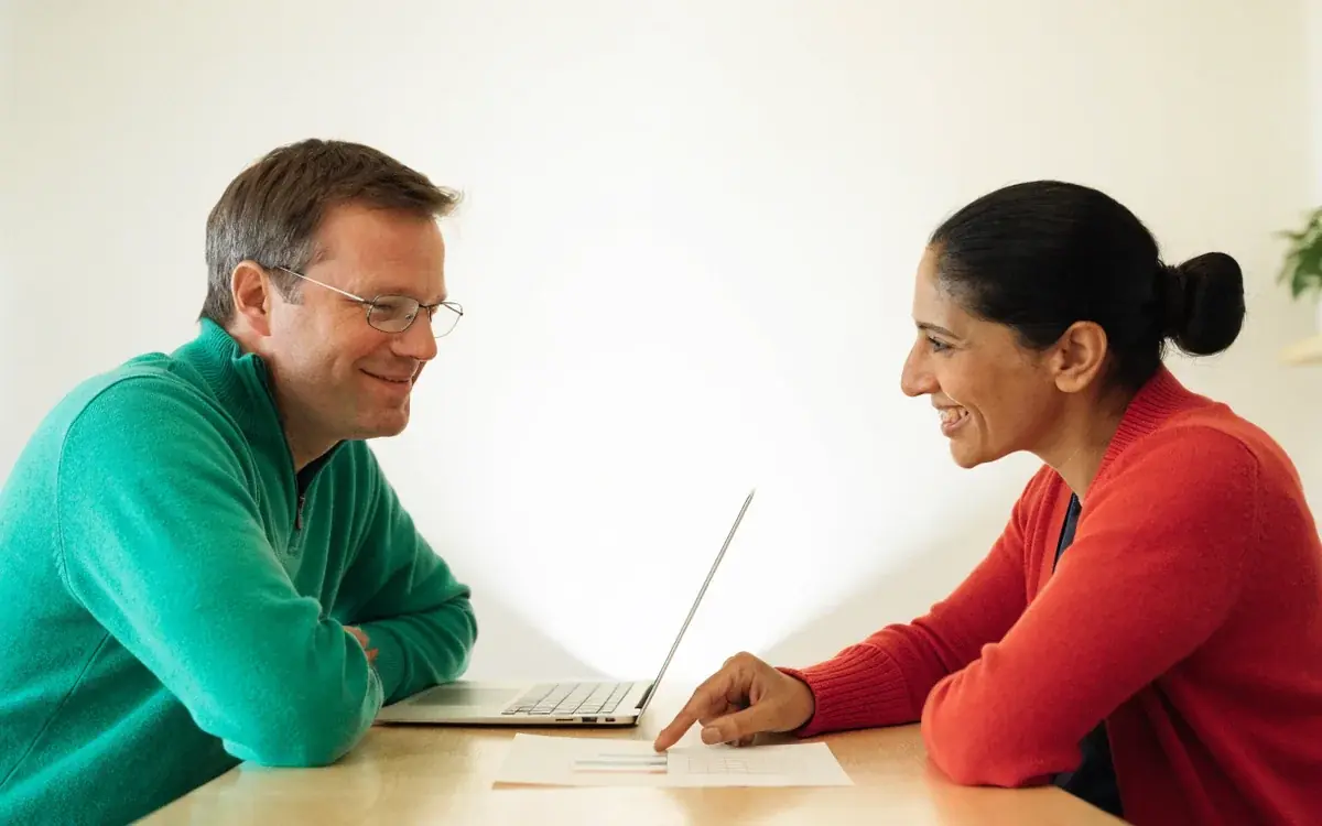 An HR manager and a teacher reviewing a tutoring report together