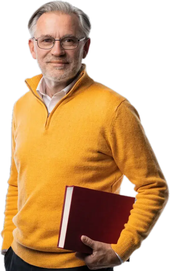 Smiling certified teacher in glasses and a marigold quarter-zip holding a red book