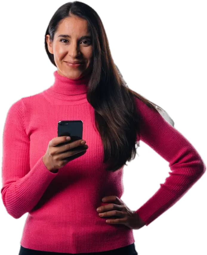 Parent in a pink sweater smiling while checking tutor matches on her phone