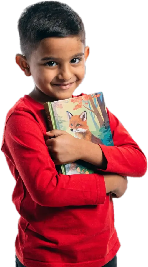 Smiling boy in a red shirt hugging a picture book with a fox on the cover