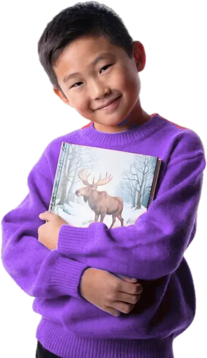 Boy in a lilac sweater holding a French picture book with a moose on the cover