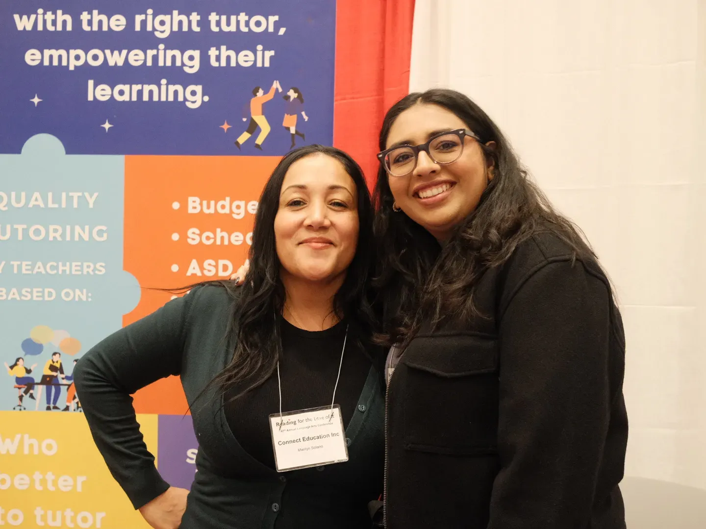 Two members of the Connect Education team at the Reading for the Love of It conference booth