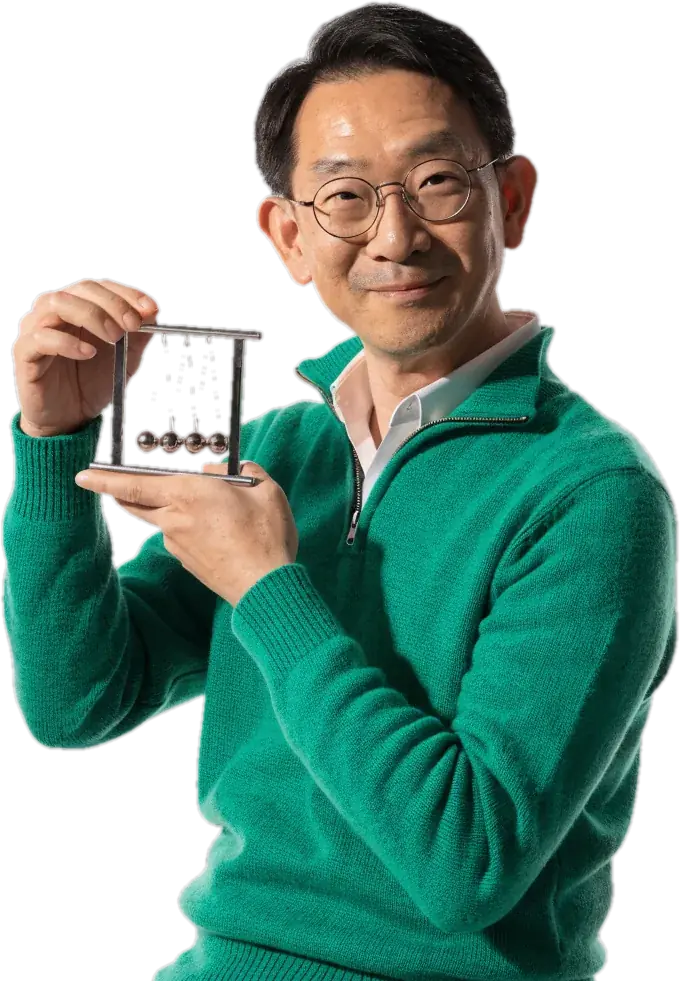Physics teacher in glasses holding a Newton's cradle