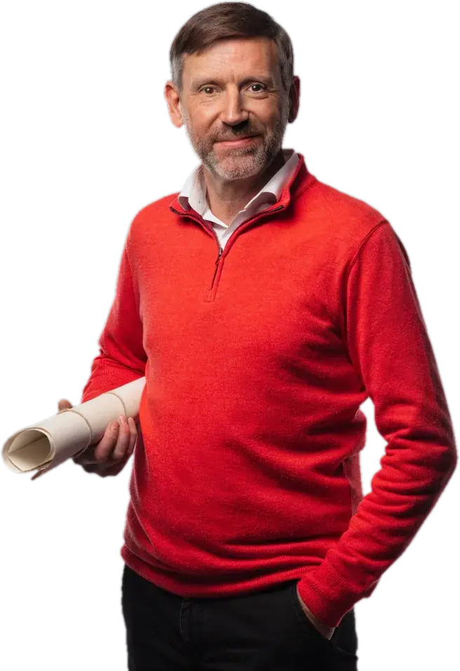 History teacher in a red quarter-zip holding a rolled-up map