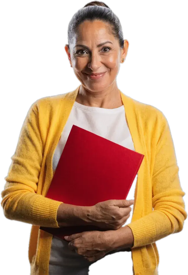 Writing teacher in a marigold cardigan holding a red folder