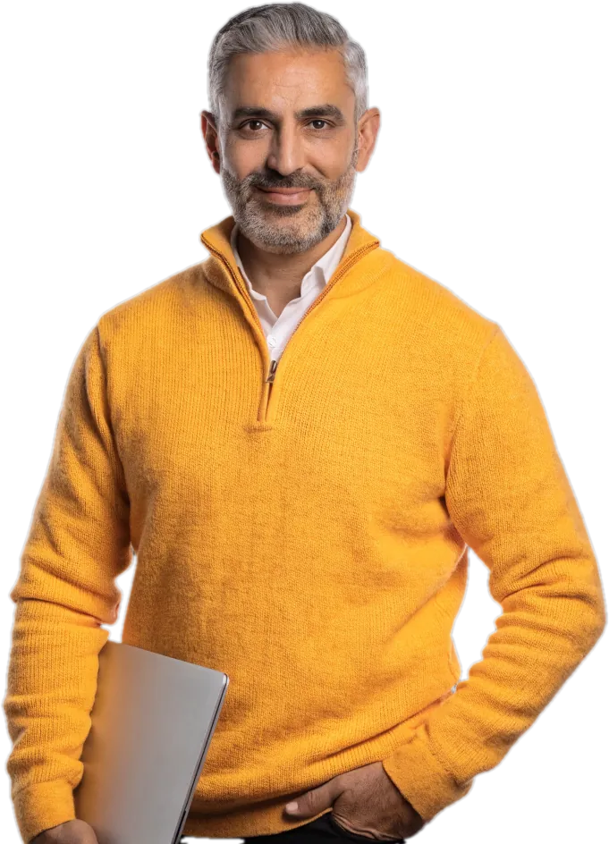 Smiling father in a marigold quarter-zip with a laptop under his arm