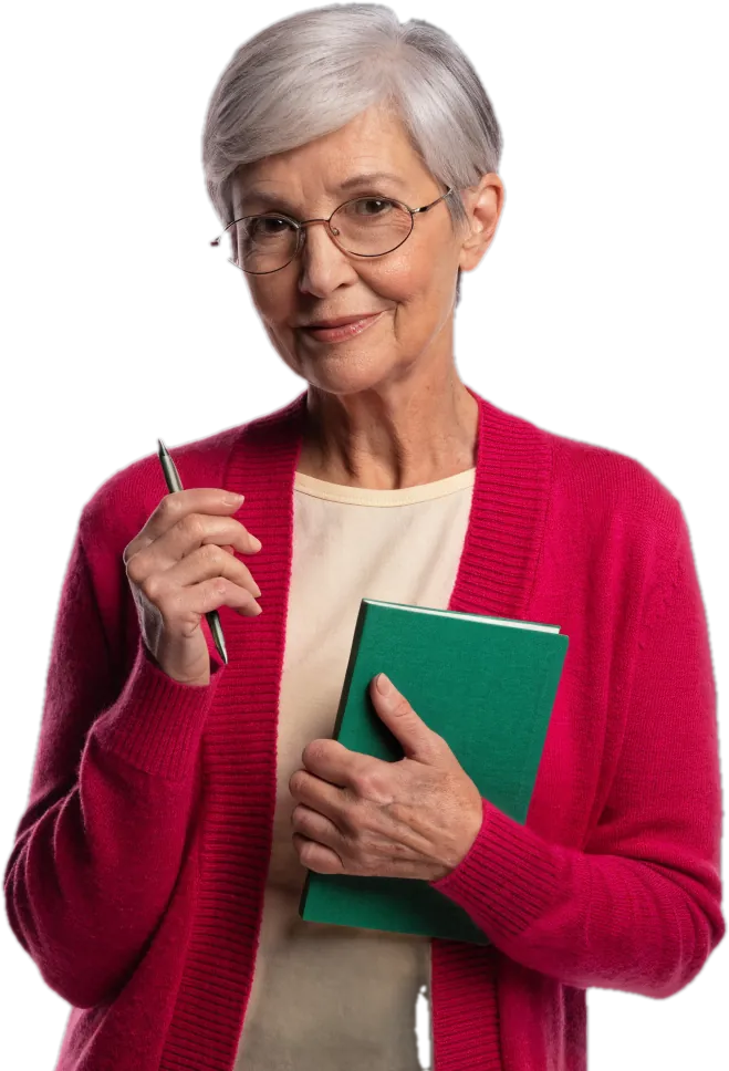 Teacher with a silver pixie cut and glasses holding a notebook and pen