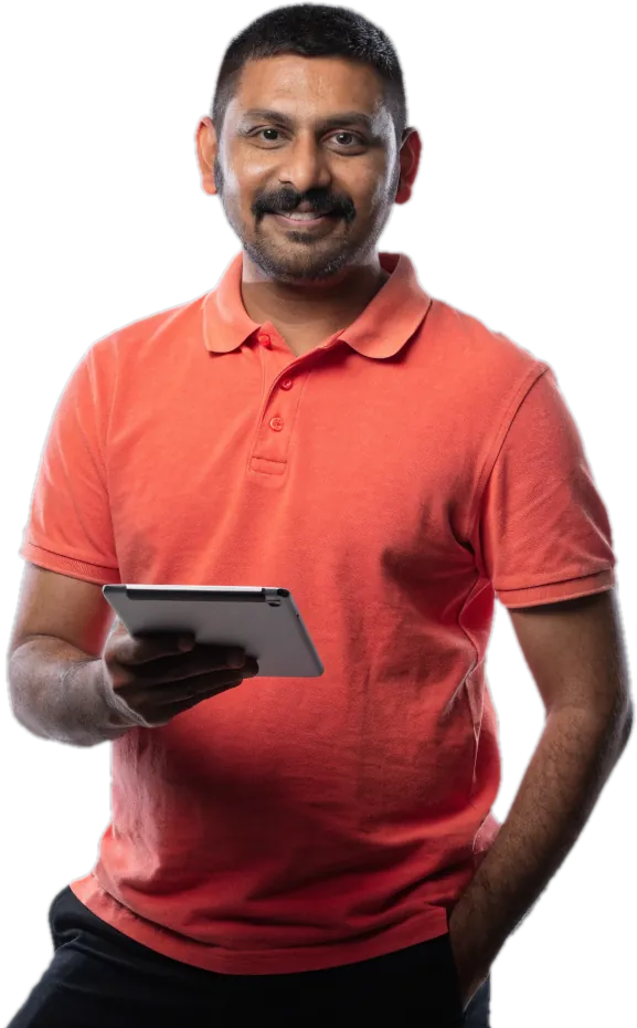Smiling father in a coral polo shirt holding a tablet