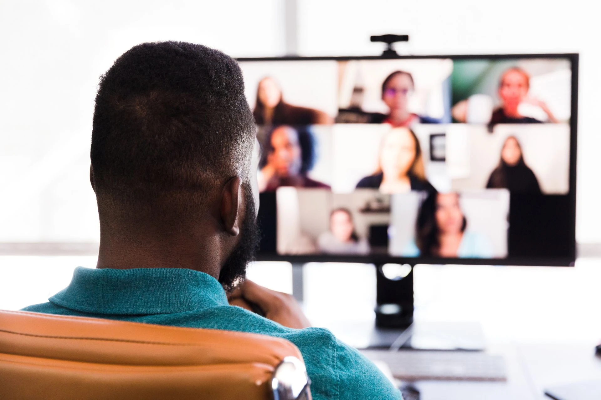 A man attending a virtual conference