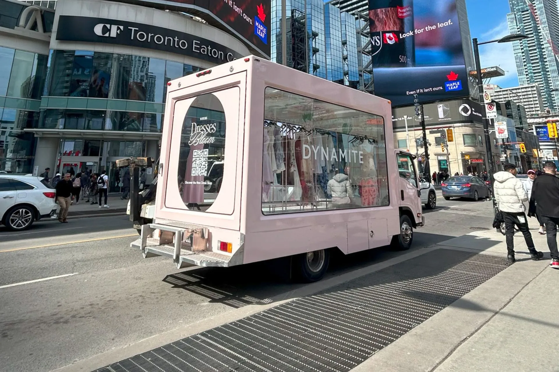Pink truck in the middle of the city