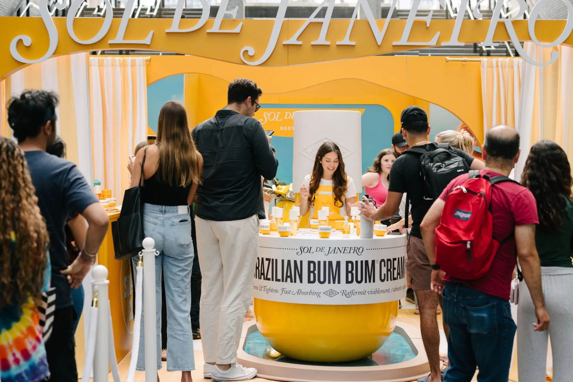 People falling in line for a booth sample