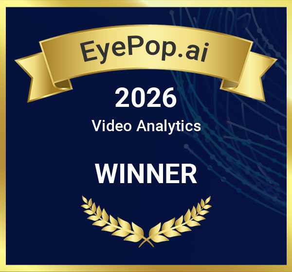 Award ribbon with text EyePop.ai, 2026 Video Analytics WINNER on a dark blue background with gold accents.