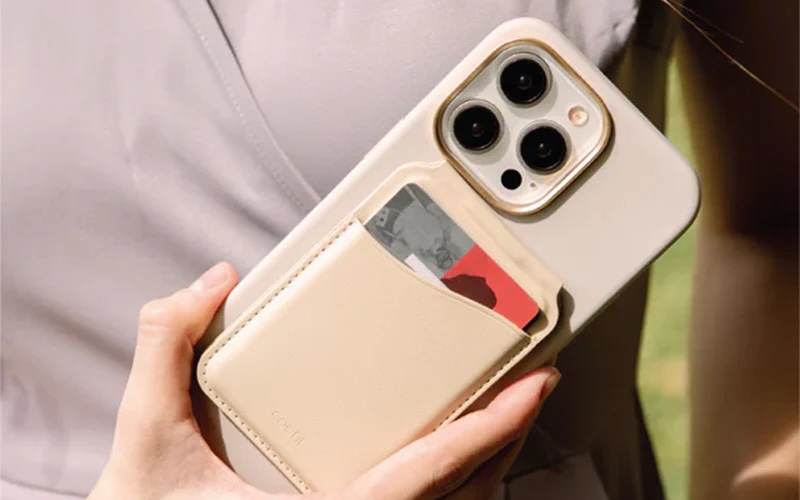 Smartphone wallet case with card holder attached to the back of the phone.