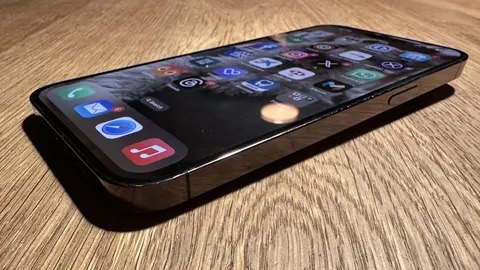 Smartphone in everyday use representing the typical phone owned by most users.