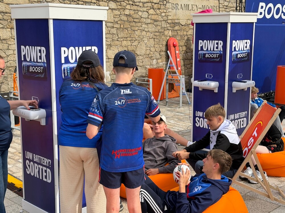 Visitors using Crable Charging Totems at a live event