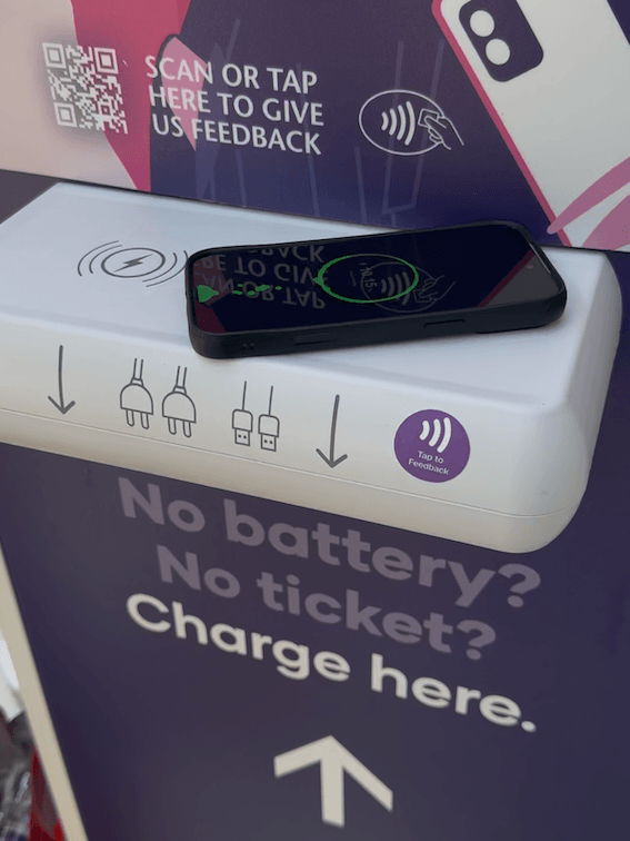 Phone using the wireless charging point on a Crable Charging Shelf