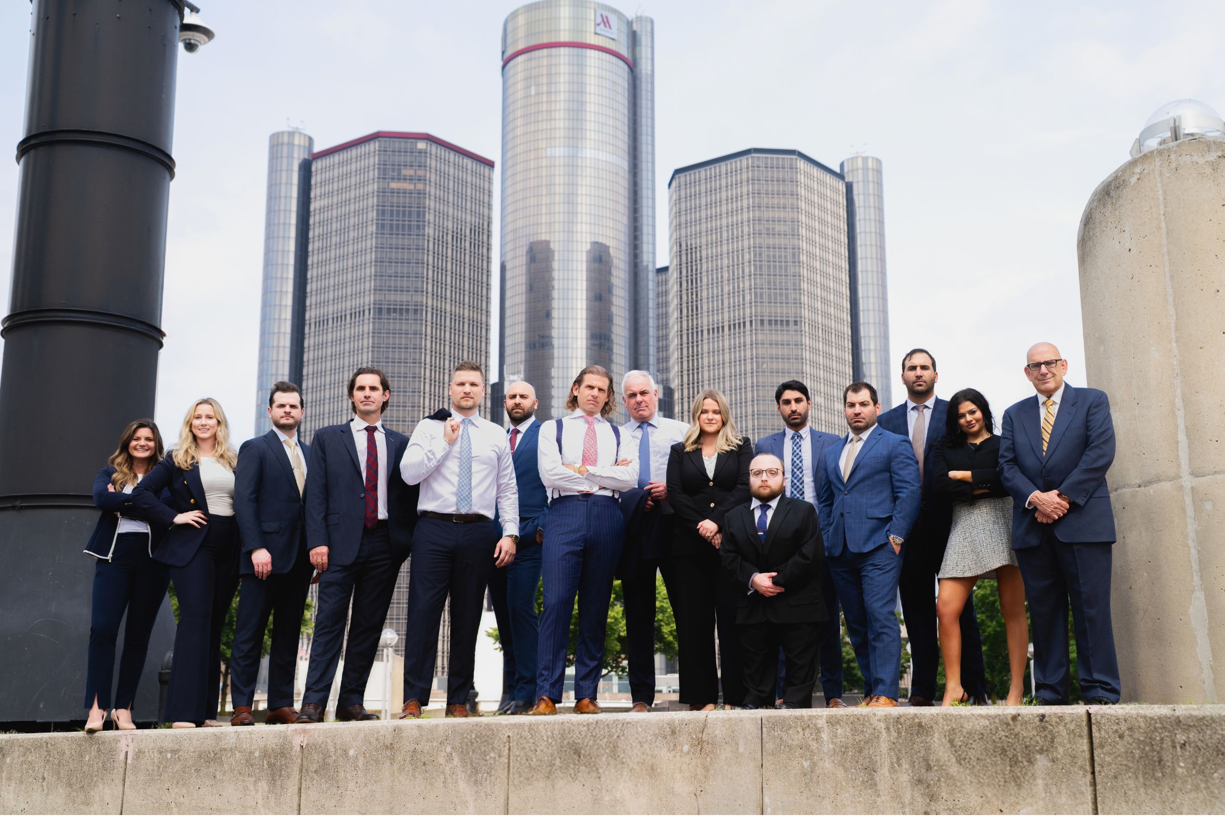 Marko Law attorneys stand together with the city scape in the background 