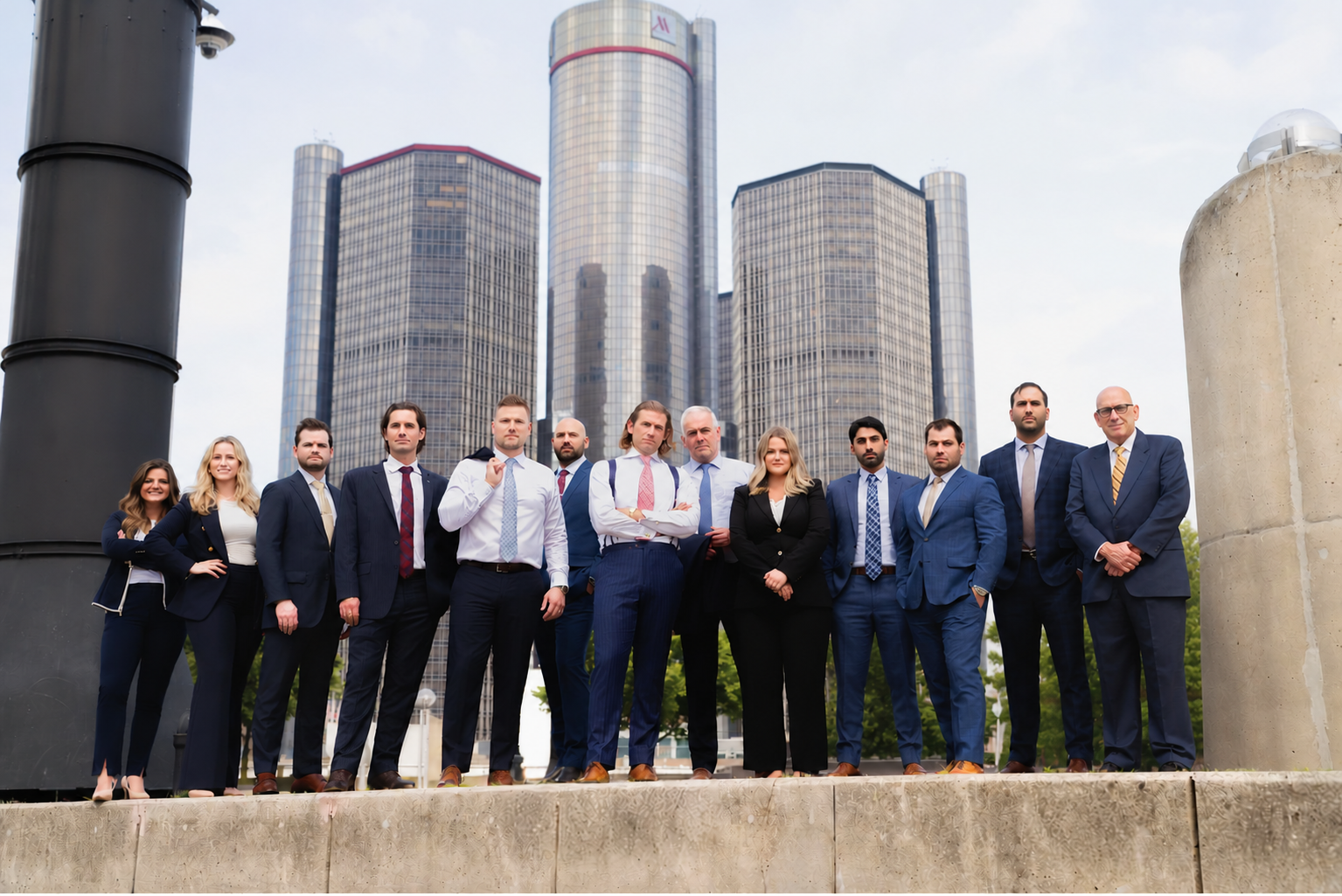 Marko Law attorneys stand together with the city scape in the background 