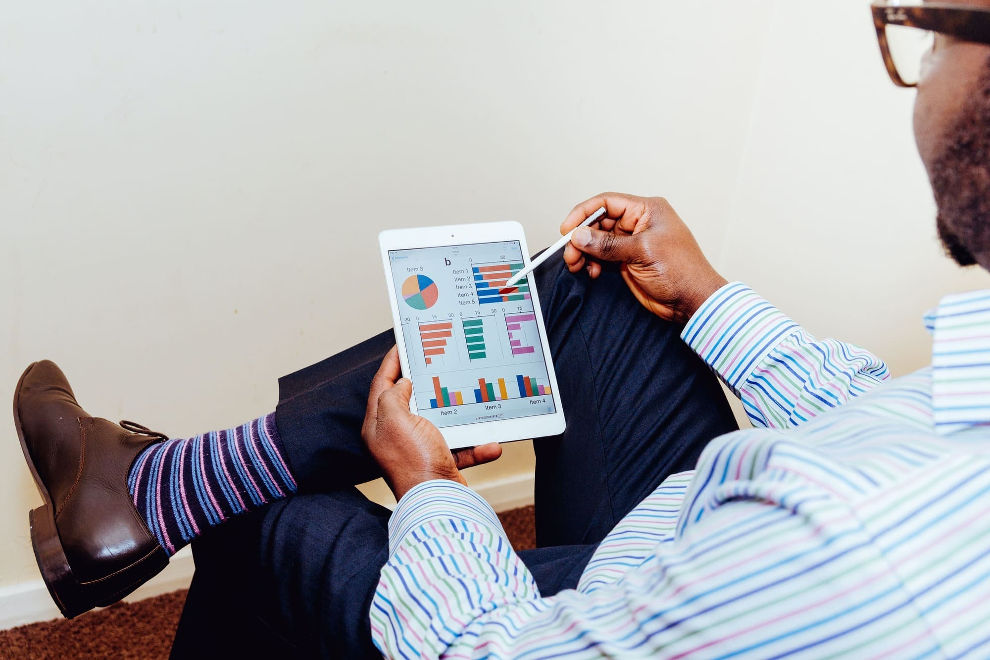 Business man sitting with an ipad
