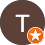 a white T on a brown circle with the Local Guide Star in the bottom right