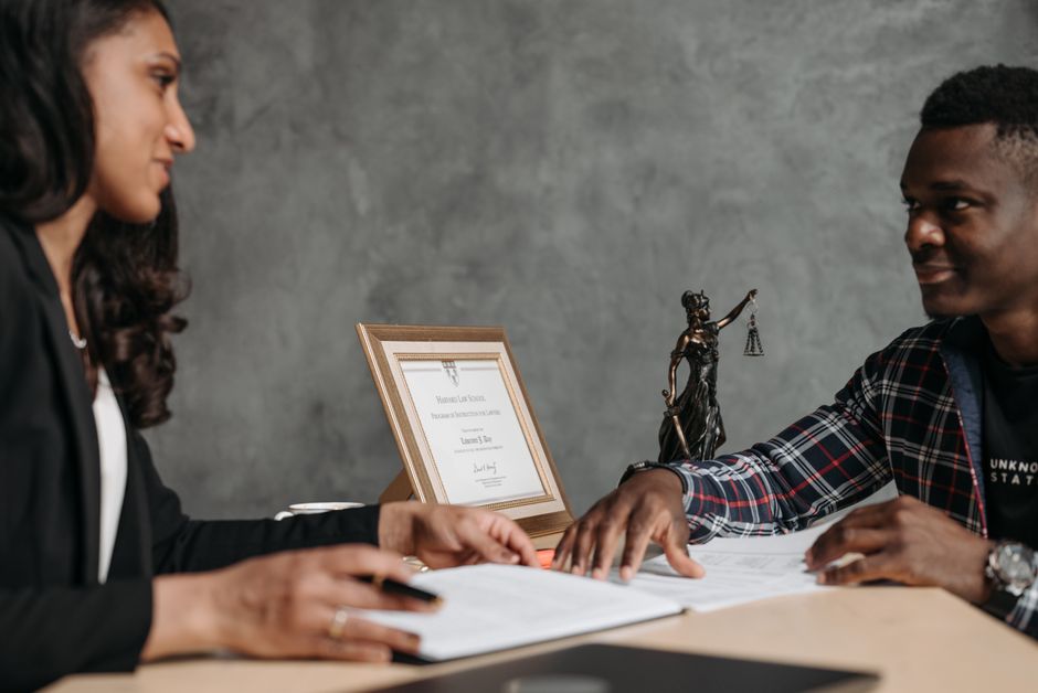 Legal consultation between an attorney and a client discussing an employment claim Legal consultation between an attorney and a client discussing an employment claim
