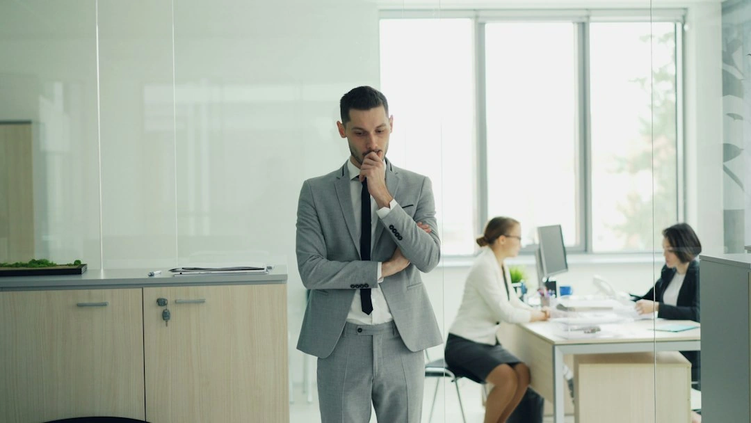 corporate manager supervising office staff
