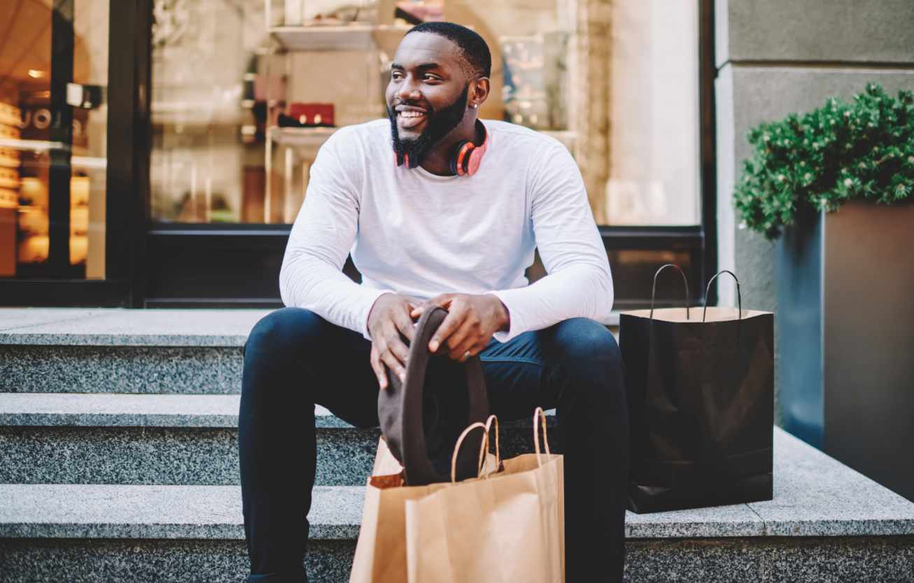 a man sitting on the steps smiling