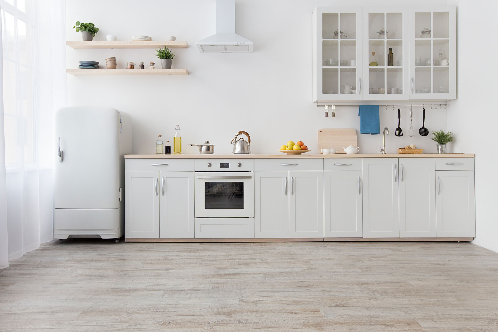 Big kitchen with waterproof flooring, combining durability and practicality. Combines modern design with long-lasting performance.