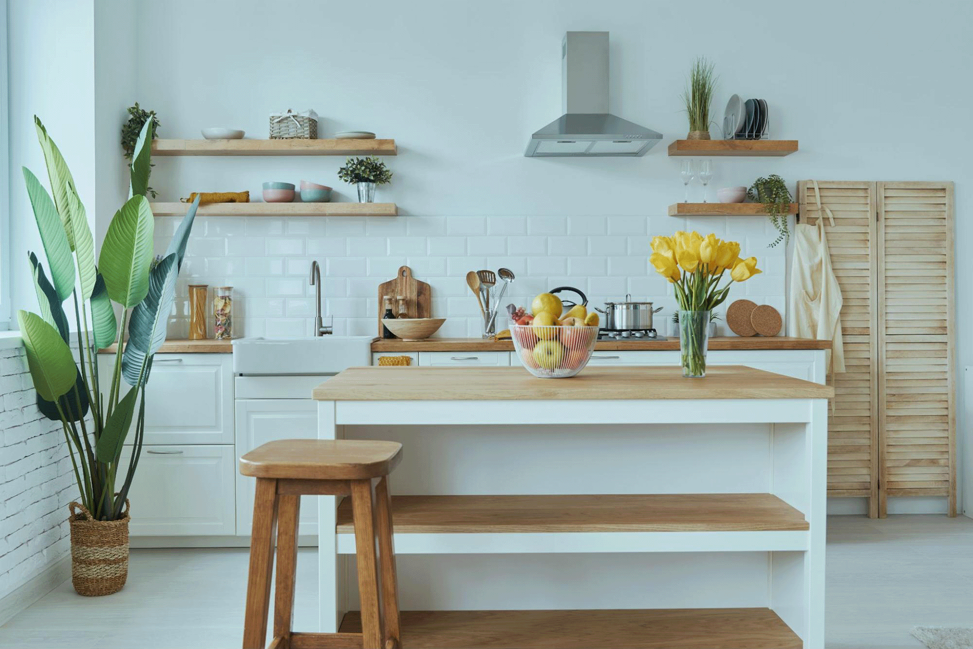 Minimalist kitchen featuring light vinyl plank flooring
