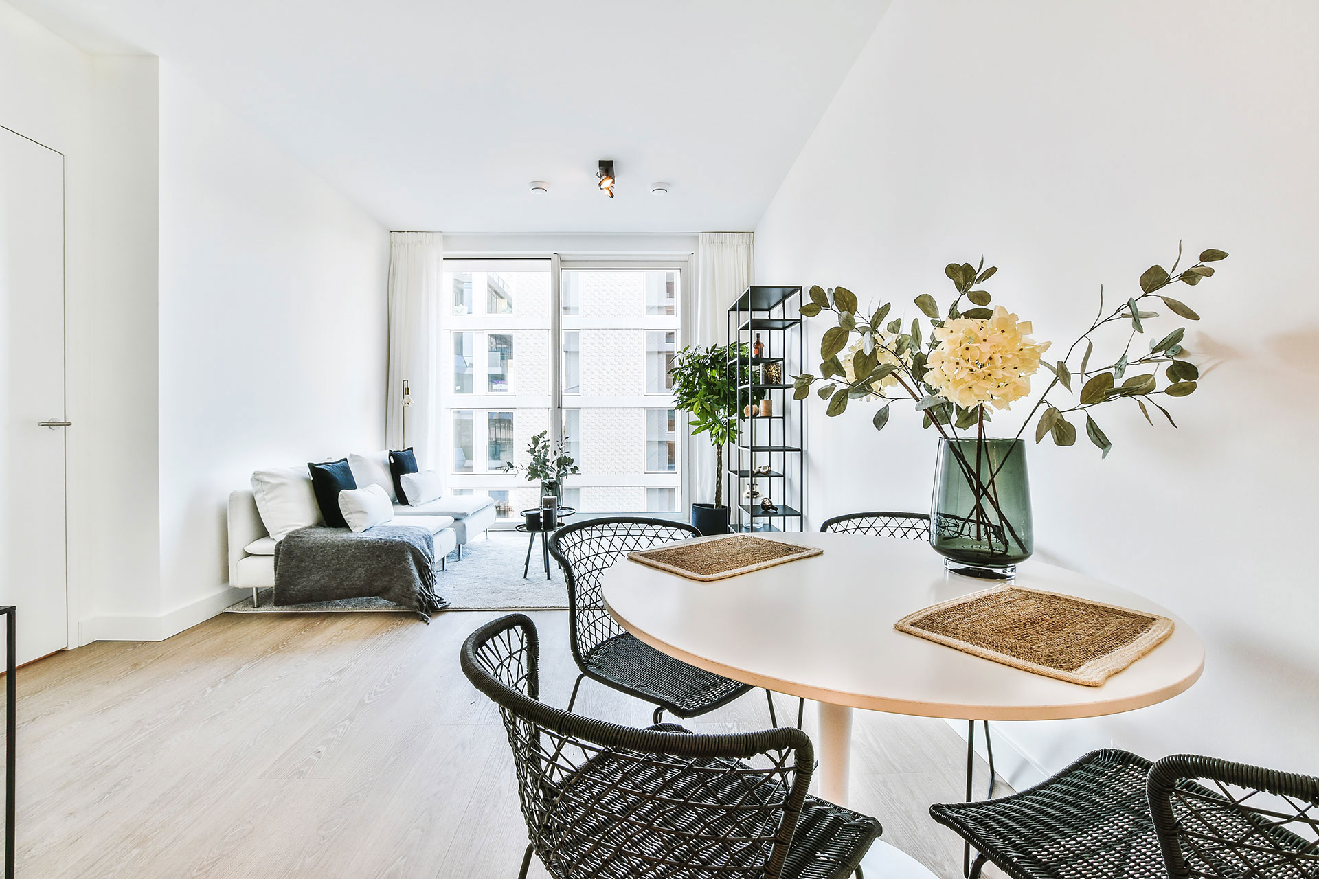 Light laminate flooring enhances this apartment interior, creating a bright and airy living space.