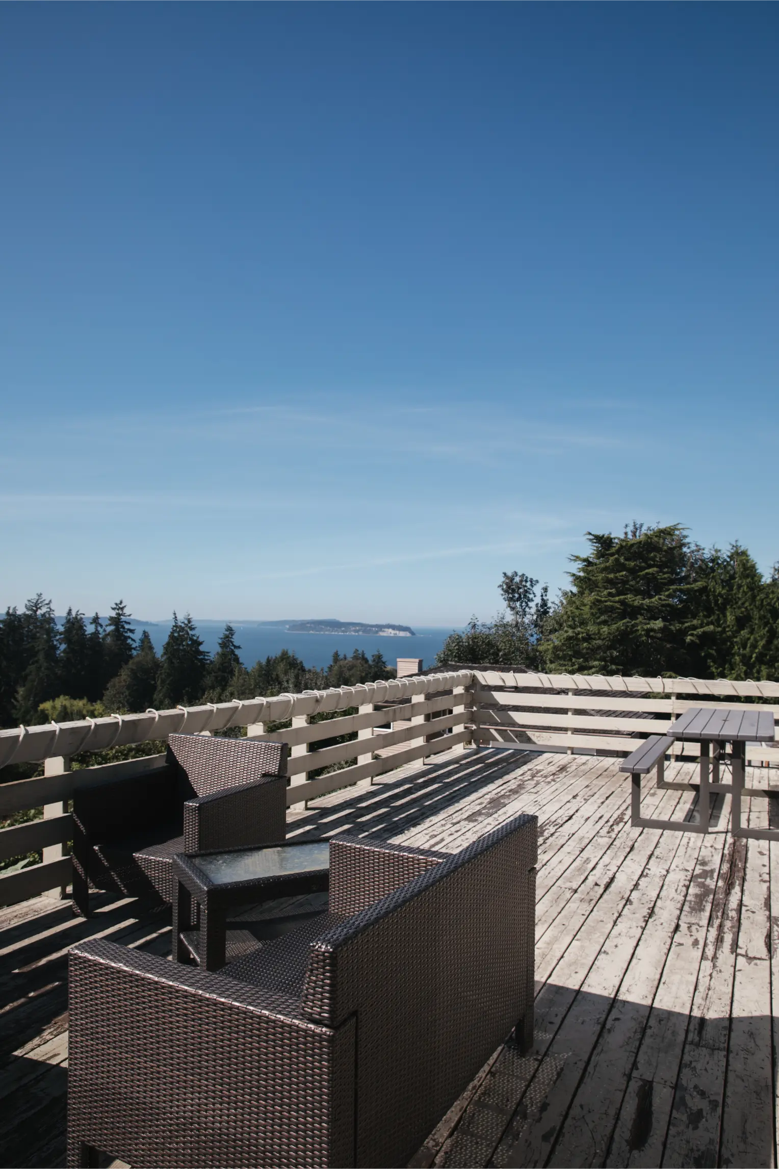 Weather-beaten wood deck lacking modern furniture and layout.