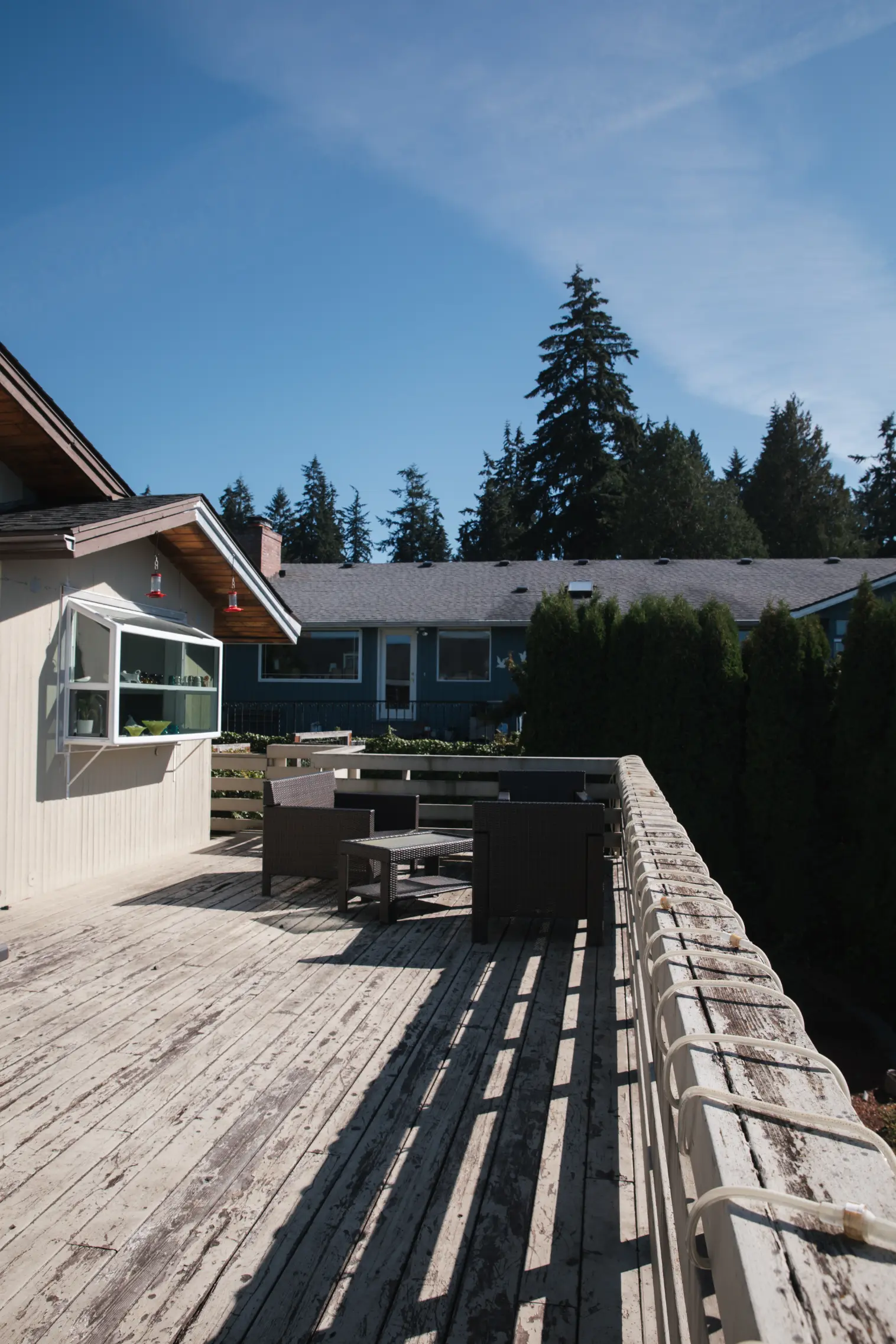 Original deck with weathered materials and outdated design.