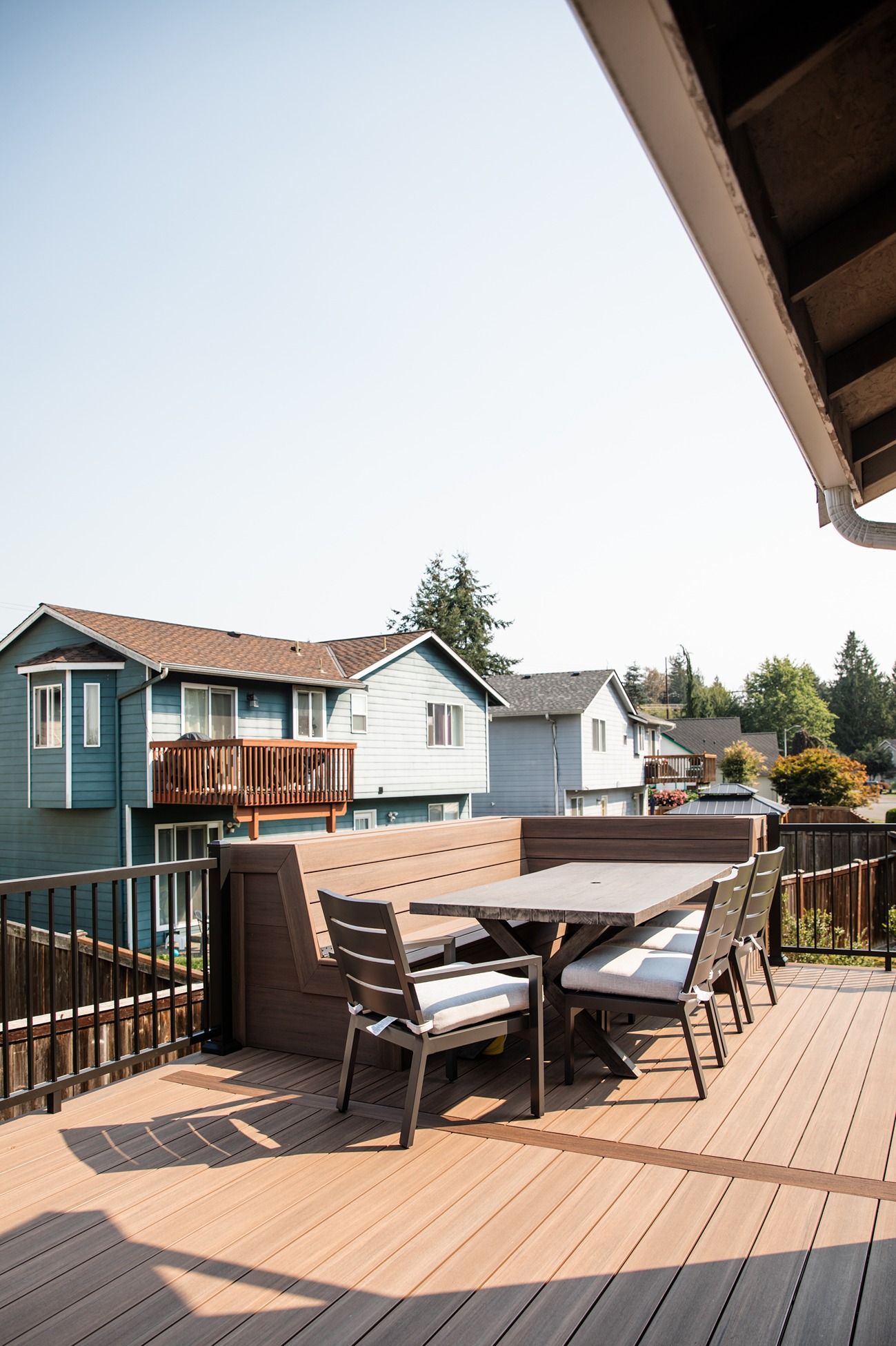 Built-in composite deck bench wrapping the deck Gallery 3