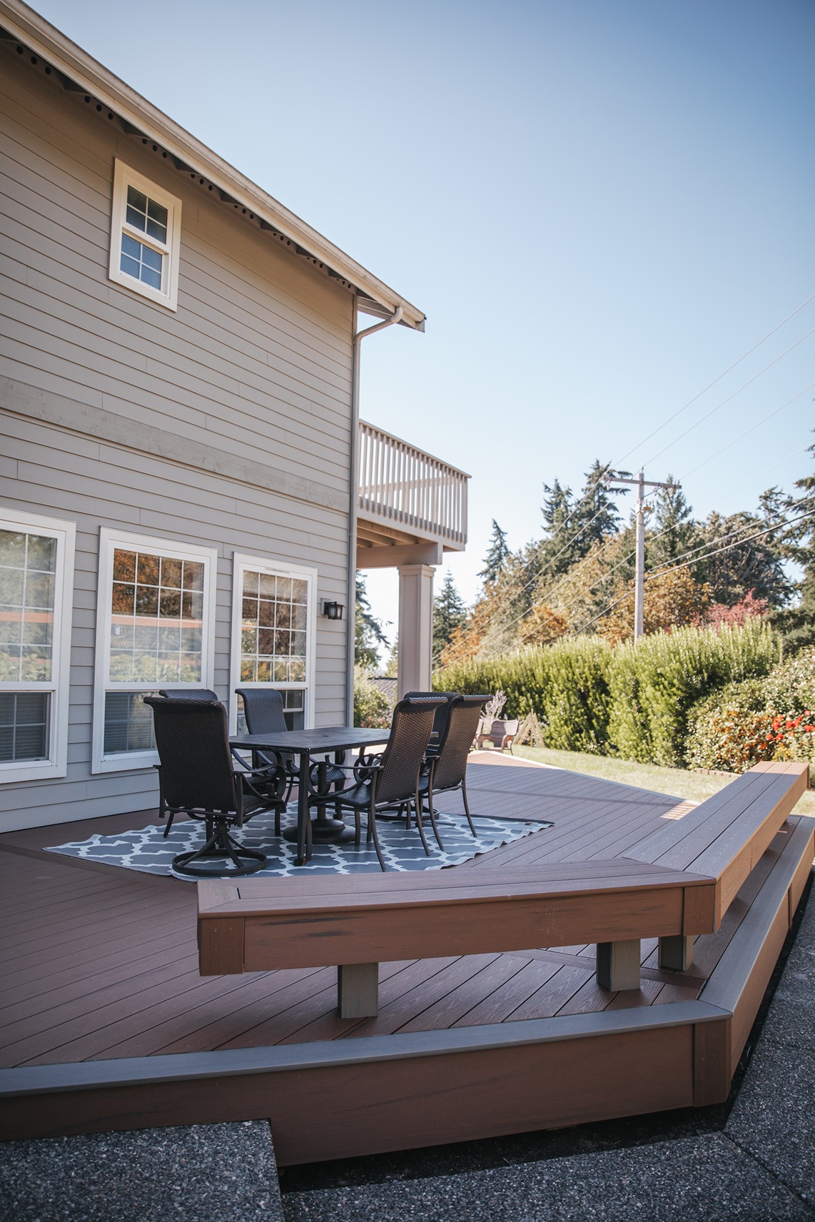Built-in composite deck bench wrapping the deck Gallery 2