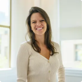 Woman in white shirt smiling