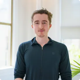 Man in black shirt smiling